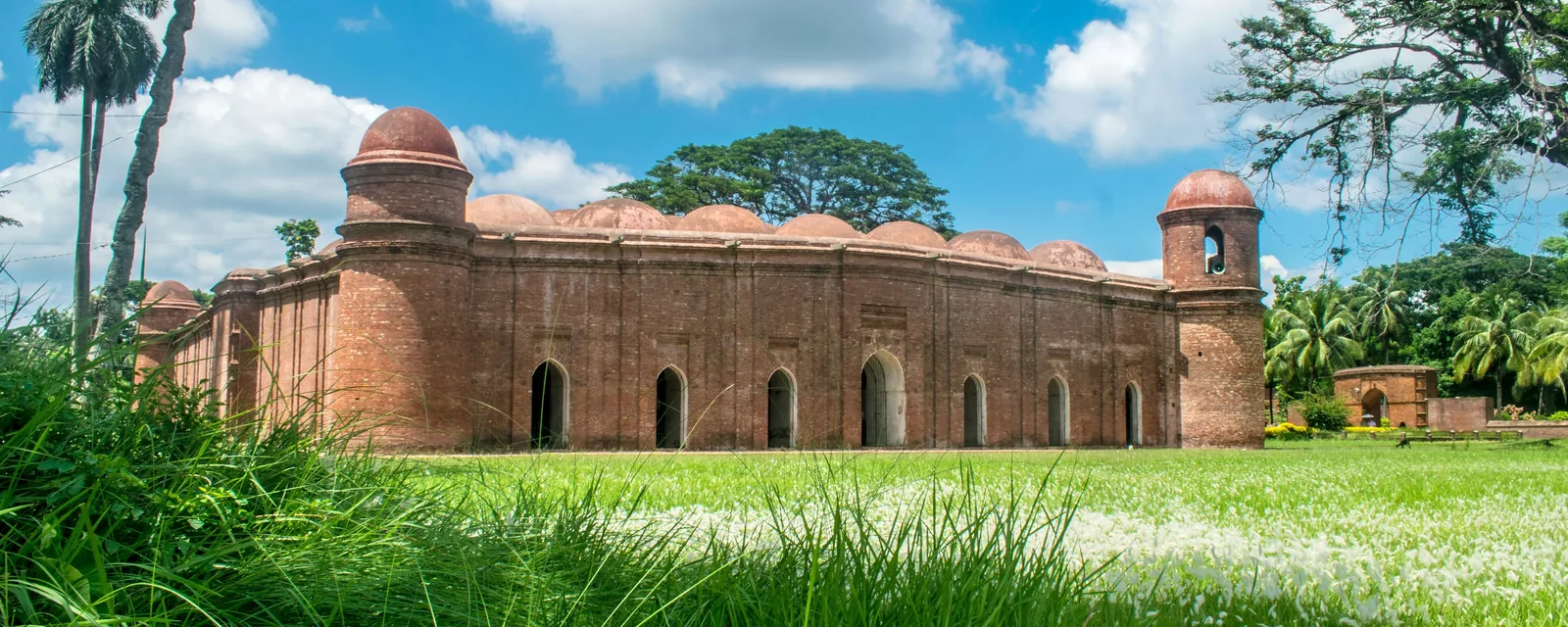 The Sixty Dome Mosque and its green grounds in Bagerhat, Bangladesh