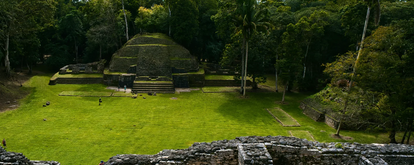 A Maya temple and stone ruins surrounded by jungle in Belize