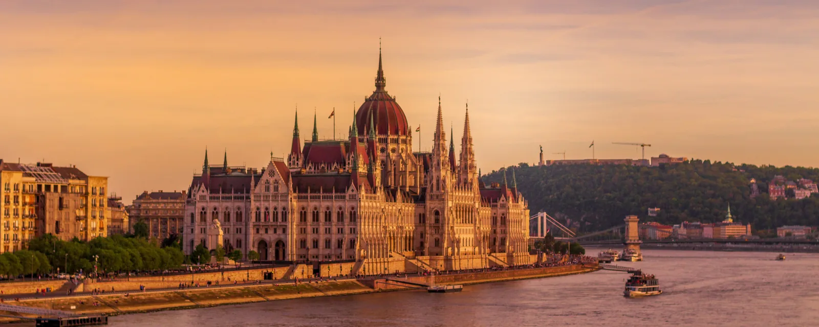 Hungarian Parliament beside the Danube at sunrise in Budapest