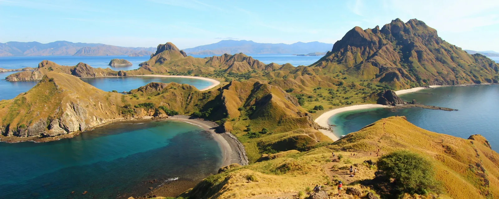 Padar Island's curving beaches and rugged hills above turquoise bays, Indonesia