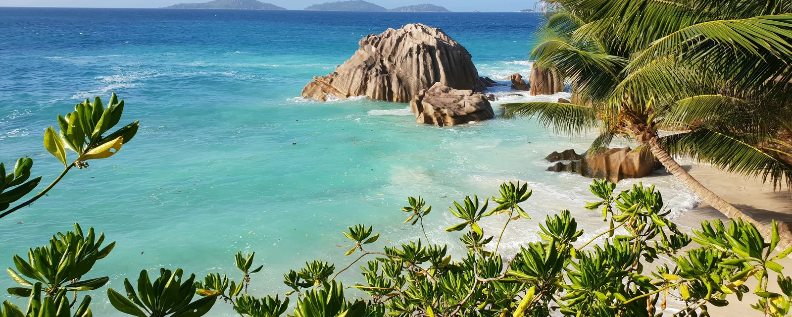 Granite rocks and turquoise sea on La Digue in the Seychelles