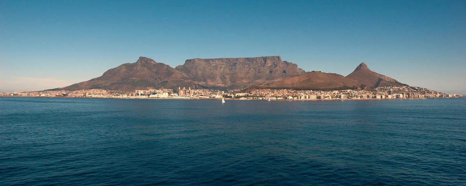Table Mountain above Cape Town seen across the blue waters of Table Bay
