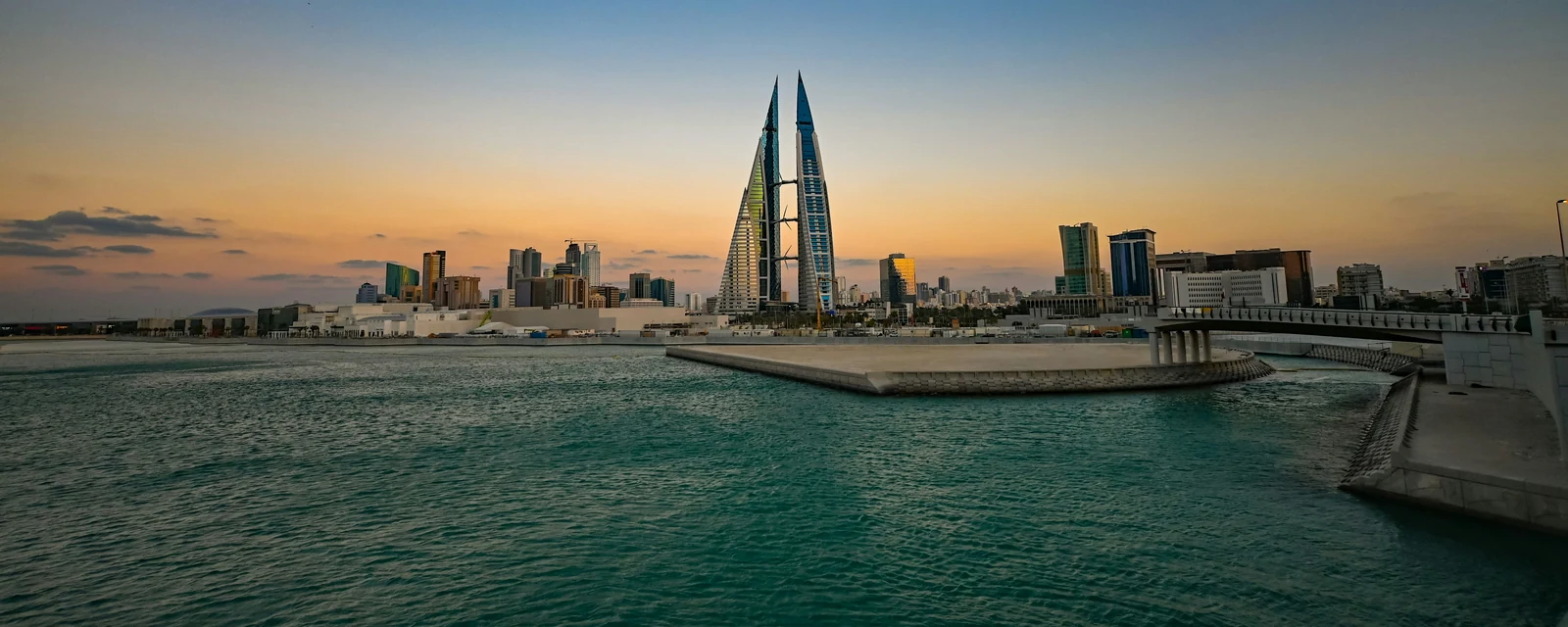 Bahrain World Trade Center above the waterfront at sunset in Manama