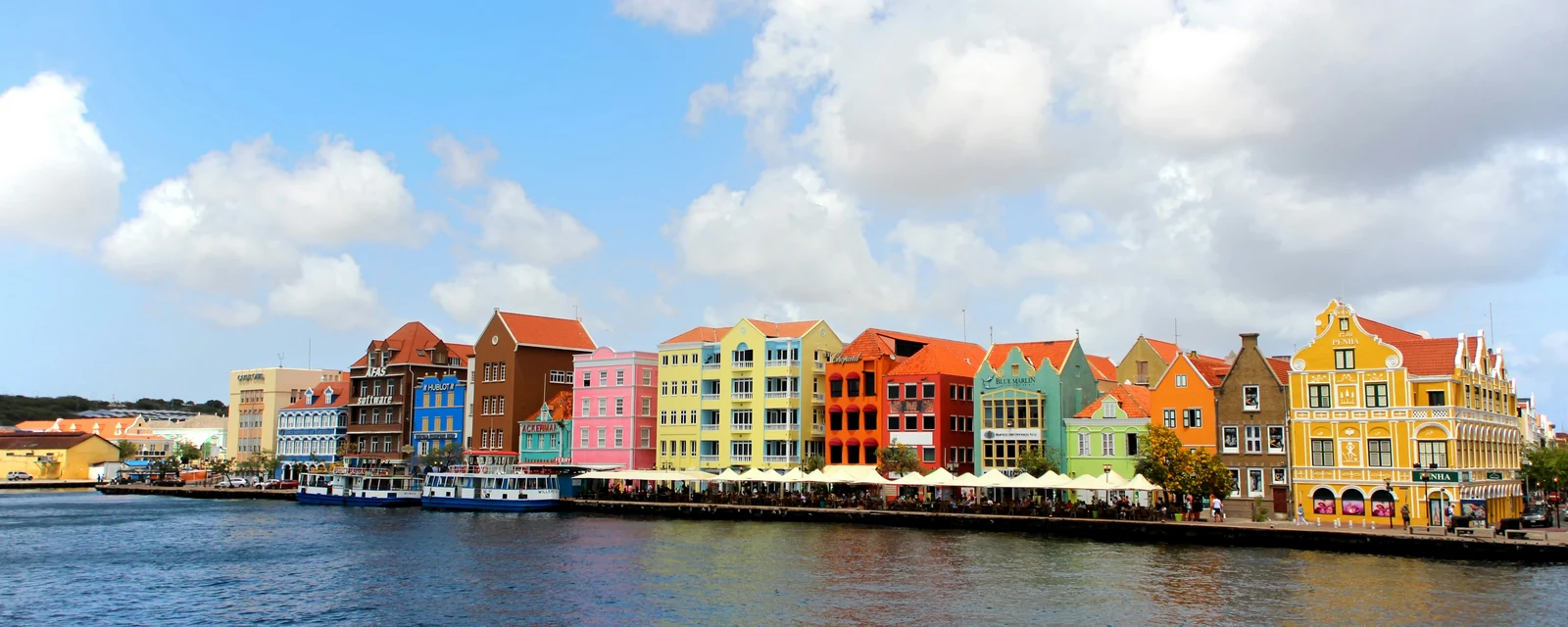 Brightly colored waterfront buildings on Handelskade in Willemstad, Curaçao