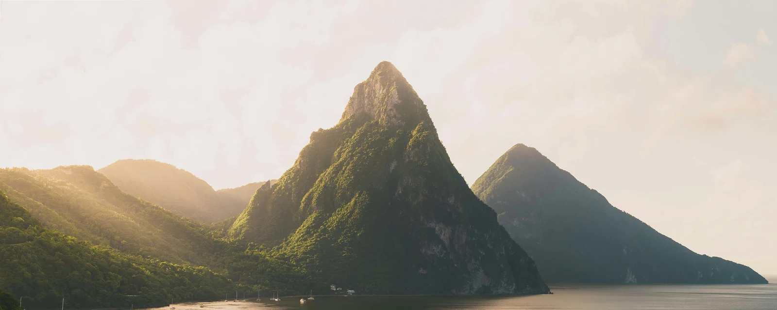 Warm light over the Pitons and the Caribbean Sea in Saint Lucia