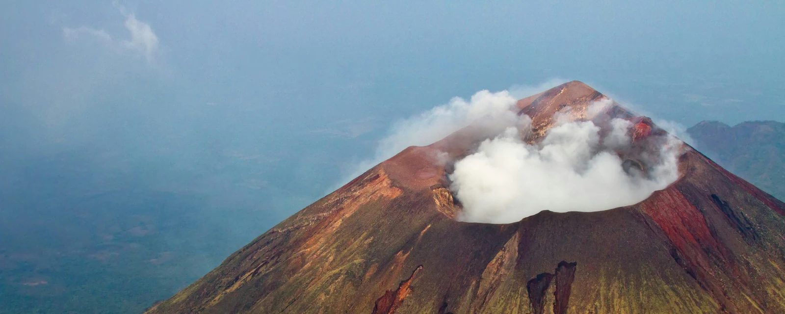 Clouds rising from the colorful summit crater of San Cristóbal volcano in Nicaragua