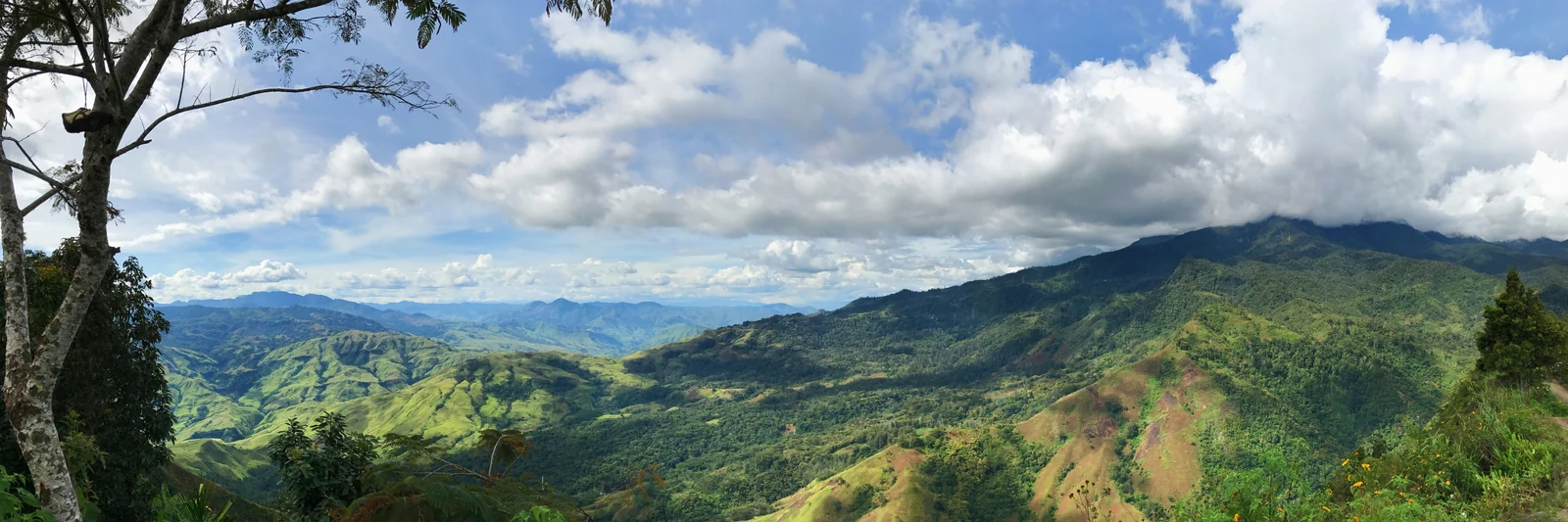 Sunlight across the green mountains of Eastern Highlands Province, Papua New Guinea